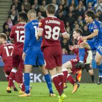 Shinji Okazaki (far right) scores the opening goal in Leicester City’s 2-0 win over Liverpool in the League Cup on Tuesday. Okazaki helps Leicester oust Liverpool from League Cup