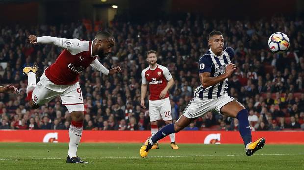 Alexandre Lacazette (left) scores with a header in Arsenal’s 2-0 win over West Brom on Monday. Lacazette strikes twice as Arsenal beats West Brom