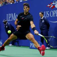 Rafael Nadal plays a shot from Juan Martin del Potro in their semifinal match at the U.S. Open on Friday night. Nadal won 4-6, 6-0, 6-3, 6-2. Vintage Nadal rallies to victory