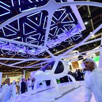 A drone taxi is seen on view at the Gitex 2017 exibition at the Dubai World Trade Center in Dubai, United Arab Emirates, Sunday. Dubai touts tech prowess, from flying taxis to robocops