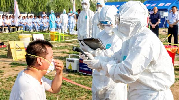 People participate in an emergency exercise on prevention and control of the H7N9 bird flu virus organized by the Health and Family Planning Commission of the local government in Hebi, Henan province, China, in June. New H7N9 bird flu strain in China has pandemic potential, U.S.-Japanese lab studies find