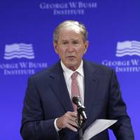 Former U.S. President George W. Bush speaks at a forum sponsored by the George W. Bush Institute in New York Thursday. Without naming names, Bush slams Trump-era politics, says 'bigotry seems emboldened'