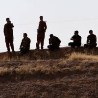 Kurdish peshmerga forces are seen near Altun Kupri, between Kirkuk and Irbil, Iraq, on Friday. Iraqi forces complete takeover over oil-rich Kirkuk province from Kurds