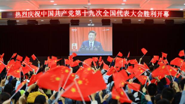 College students in Huaibei, in China’s Anhui province, watch President Xi Jinping address the Communist Party congress on Wednesday. Xi lays out road map to make China leading global power by 2050