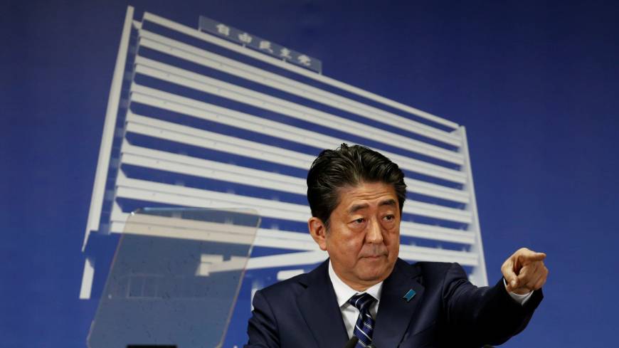 Prime Minister Shinzo Abe, who is also leader of the Liberal Democratic Party, is seen at a news conference at LDP headquarters in Tokyo on Monday. Abe claims victory as powerful endorsement, may seek re-election next month