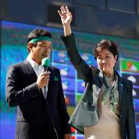 Tokyo Gov. Yuriko Koike, who heads Kibo no To (Party of Hope), attends a campaign rally in Tokyo on Tuesday. Koike's policies on foreign affairs and security receiving more scrutiny ahead of election
