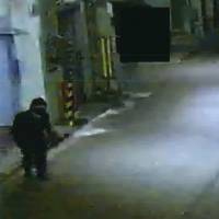 Security camera footage shows Mitsuaki Tanigawa dressed in black from head to toe after he allegedly robbed a nearby home in Higashiosaka, Osaka Prefecture. To catch a 'ninja' thief: Osaka police unmask 74-year-old cat burglar