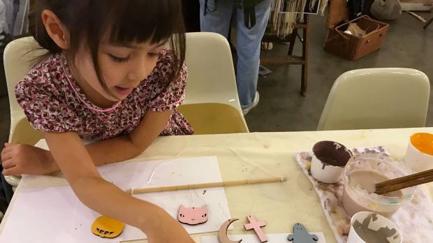A blissful moment of peace as kids at a Small is More workshop create a Halloween-inspired mobile. A crafty way to give the kids a creative workout