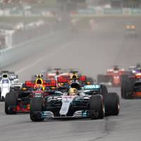 Lewis Hamilton leads the field into turn one at the start of the Malaysian Grand Prix on Sunday in Sepang, Malaysia. Lewis Hamilton heads to Japan wary of challengers
