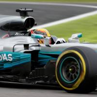Mercedes’ Lewis Hamilton takes part in Saturday’s qualifying for the Japanese Grand Prix in Suzuka, Mie Prefecture. Lewis Hamilton nabs pole for Japanese Grand Prix