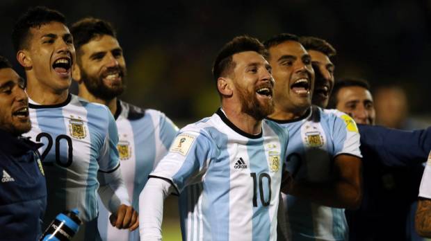 Lionel Messi (10) and his Argentina teammates celebrate World Cup qualification after beating Ecuador in Quito on Tuesday. Messi hat trick punches Argentina's World Cup ticket