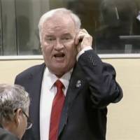 Ex-Bosnian Serb wartime general Ratko Mladic reacts in court at the International Criminal Tribunal for the former Yugoslavia (ICTY) in the Hague, Netherlands, in this still image taken from a video released by the International Criminal Tribunal for the former Yugoslavia (ICTY) Wednesday. U.N. court finds 'Butcher of Bosnia' Ratko Mladic guilty of genocide and war crimes, jails him for life