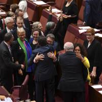 Australian senators celebrate after the same-sex marriage bill passed the body at Parliament House in Canberra on Wednesday. Australian Senate passes same-sex marriage bill in key step
