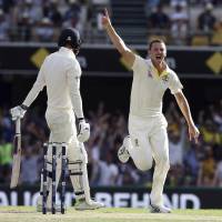 Australia’s Josh Hazlewood (right) celebrates after getting the wicket of England’s James Vince during the Ashes test in Brisbane, Australia, on Saturday. Steve Smith contributes masterful ton as England cracks in Ashes battle