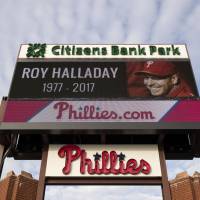 A sign outside Citizens Bank Park displays a message in remembrance of former Phillies pitcher Roy Halladay in Philadelphia on Wednesday, Nov. 8, 2017. Former pitcher Roy Halladay flew airplane low before crash, witnesses say