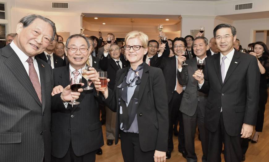 Latvian Ambassador Dace Treija-Masi (center) joins guests in a toast on Nov. 16 to celebrate of the 99th anniversary of the Republic of Latvia at the embassy in Tokyo.