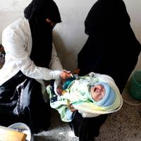 A Yemeni child receives a polio vaccination on the outskirts of Sanaa Monday. The United Nations has listed Yemen as the world’s number one humanitarian crisis, with 7 million people on the brink of famine and a cholera outbreak that has caused more than 2,000 deaths. Blockade could push Yemen into 'humanitarian catastrophe' as 8.4 million on brink of famine: WFP