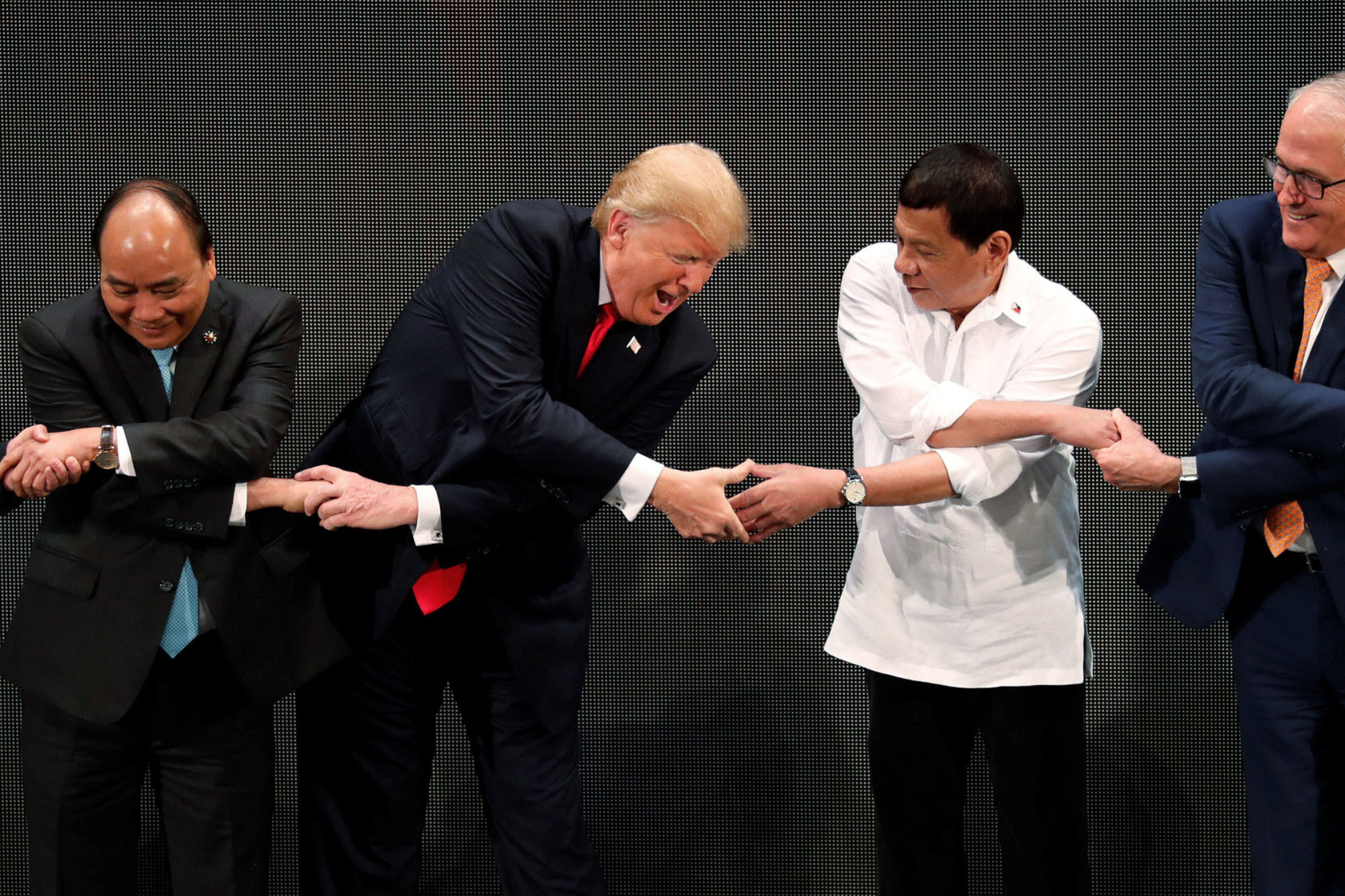 Getting handy: Vietnamese Prime Minister Nguyen Xuan Phuc, U.S. President Donald Trump, Philippine President Rodrigo Duterte and Australian Prime Minister Malcolm Turnbull participate in the opening ceremony of the ASEAN Summit in Manila in November.