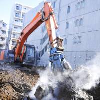 Demolishing decisions: Razing an old home to leave a cleared piece of land is often the most sensible way to deal with abandoned property in Japan. Fuji TV's home-improvement wrecking ball