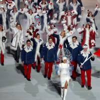 The Russian team takes part in the parade at the opening ceremony for the Sochi Olympics on Feb. 7, 2014. No winners in IOC's decision to ban Russia