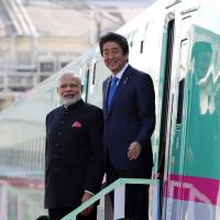 Prime Minister Shinzo Abe and Indian Prime Minister Narendra Modi leave an E5 series shinkansen during a visit to a plant run by Kawasaki Heavy Industries Ltd.’s Rolling Stock Co. in Kobe in 2016. Japanese companies in driver's seat for Indian bullet train deals