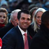 Donald Trump Jr. waits for the arrival of U.S. President Donald Trump before the 95th annual National Christmas Tree Lighting ceremony at the Ellipse in President’s Park near the White House in Washington Nov. 30. Former White House chief strategist Steve Bannon has described a meeting between President Trump’s son, Don Jr., and a Russian lawyer during the 2016 presidential election campaign as “treasonous” and “unpatriotic,” The Guardian reported Wednesday. Trump tries to block release of 'libelous' book portraying White House dysfunction