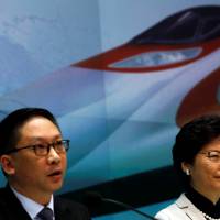 Hong Kong Chief Executive Carrie Lam and Justice Secretary Rimsky Yuen attend a news conference on arrangements at the new West Kowloon Terminus for the Guangzhou-Shenzhen-Hong Kong express rail Link in Hong Kong last Wednesday. Anti-Beijing protesters march in Hong Kong against Beijing 'suppression'