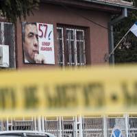 A poster bearing a picture of leading Kosovo Serb politician Oliver Ivanovic hangs on the wall of his offices after he was killed in a brazen drive-by shooting in Mitrovica on Tuesday. Prominent Kosovo Serb politician Oliver Ivanovic assassinated
