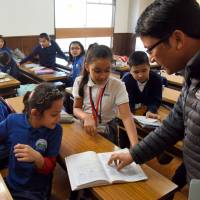 Students from Nepal study at Everest International School in Tokyo, receiving education in line with an all-English curriculum adopted by schools back home. Filipinos and Nepalese face challenges in Japan even as their communities grow