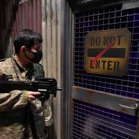 Reality bites: A member of Black-Max patrols the interior of Inspyre, an alternate reality game facility run by Humax Entertainment. Game on! Japan's live-action games offer players a fleeting escape from reality