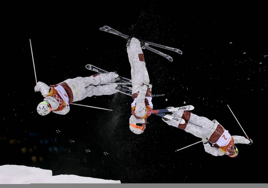In this multiple exposure photo, Andi Naude, of Canada, jumps during the women