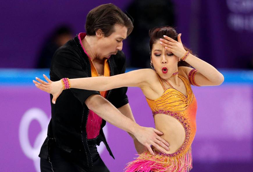 Kana Muramoto and Chris Reed of Japan compete in the Ice Dance team figure skating event at the Gangneung Ice Arena.