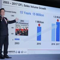 Jun Seki, Nissan’s China chief, speaks during a news conference in Beijing on Monday. Nissan to pump ¥1.05 trillion into China business, eyeing spot among country's top three carmakers