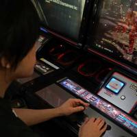 Esports player Yota Kachi, aka Pekos, plays Bandai Namco Holdings Inc.’s “Tekken 7” at a Tokyo arcade on Tuesday. At last, Japan gives nod to gaming as a profession