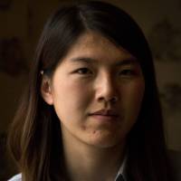 Women rights activist Li Maizi poses in Beijing on April 18, 2015, the year she was detained for handing out stickers protesting sexual harassment. China's 'female morality schools' spark outcry