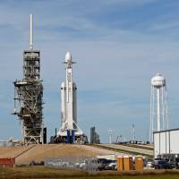 A SpaceX Falcon Heavy rocket stands on historic launch pad 39A as it is readied for its first demonstration flight at the Kennedy Space Center in Cape Canaveral, Florida, on Monday. New SpaceX jumbo rocket set for debut test launch in company milestone