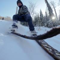 Alimase skis with traditional horsehide skis in the village of Khom in the Xinjiang Uighur Autonomous Region of China on Jan. 27. Preserving skiing's horsehide origins in China's remote west