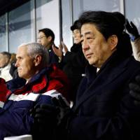 Prime Minister Shinzo Abe sits with U.S. Vice President Mike Pence and Pence’s wife, Karen, as North Korea’s nominal head of state, Kim Yong Nam (center, back), claps during the opening ceremony of the Pyeongchang Winter Olympic Games in the South Korean city Friday. Abe takes up nuclear issue and abductions in chat with North Korea's ceremonial leader