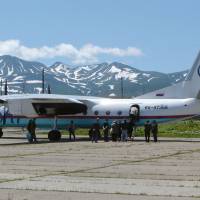 Passengers board a plane at the decrepit Burevestnik Airport on Etorofu in the Northern Territories in 2005. Civilian flights now fly from the modern Iturup Airport. Hopes wither for World War II peace treaty as Russian military muscles onto Kurils