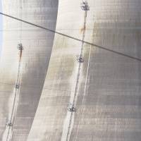 Decommissioned cooling towers sit idle behind power lines at Exelon Corp.’s Three Mile Island nuclear power plant in Middletown, Pennsylvania. America's nuclear reactors could run as long as 80 years under Trump plan