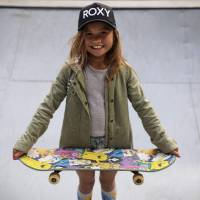 Sky Brown poses with her skateboard at a park in Kijo, Miyazaki Prefecture, on Jan. 14. Sky's the limit for Japan's pint-sized Olympic skateboarding hopeful