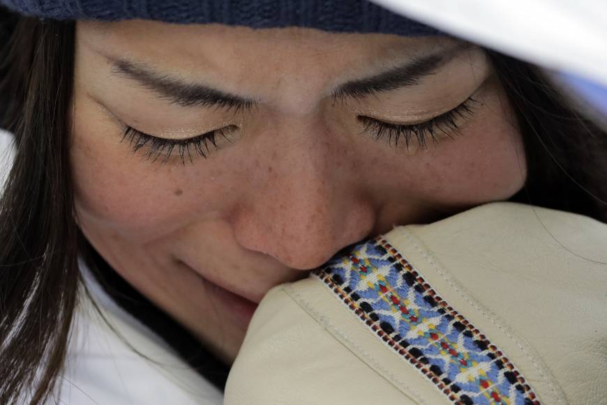 Hikaru Oe, of Japan, reacts to her score during the women