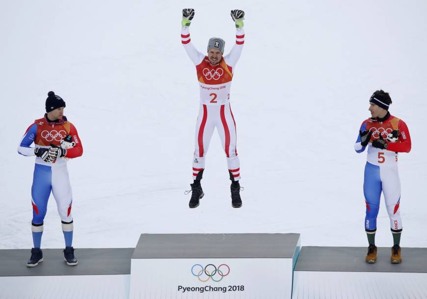 Alexis Pinturault of France, Marcel Hirscher of Austria, and Victor Muffat-Jeandet of France react during the men
