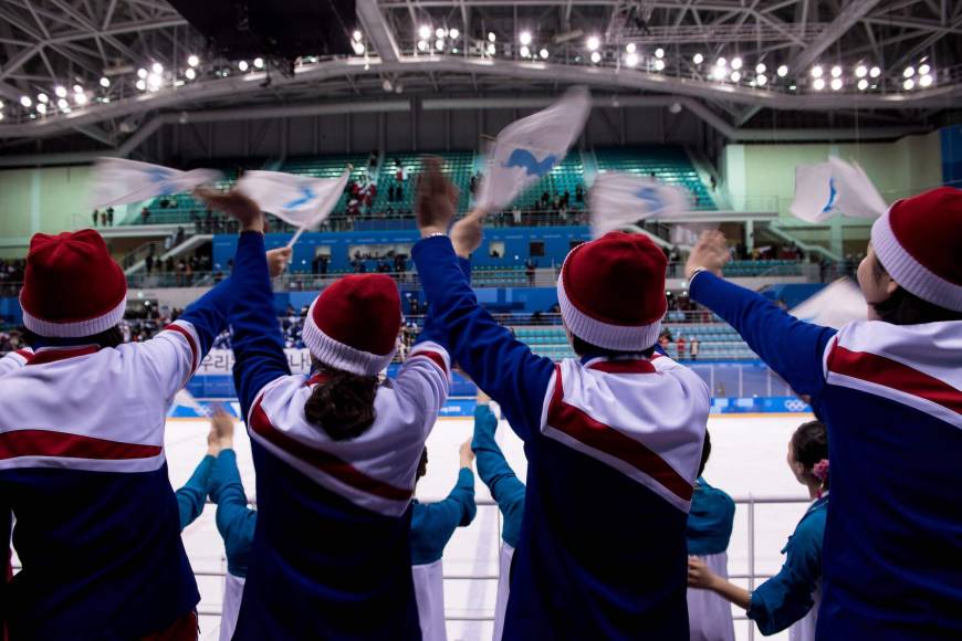 North Korean cheerleaders wave the Unified Korea flags after the women