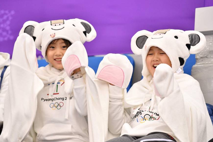 Children attend the short track speed skating event during the Pyeongchang at the Gangneung Ice Arena.