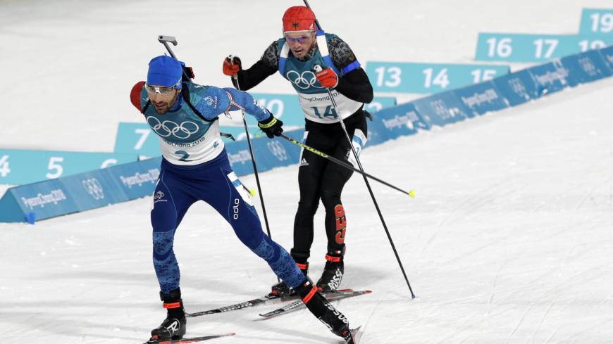 France’s Martin Fourcade (left) and Germany’s Simon Schempp race during the men’s 15-km mass start biathlon on Sunday in Pyeongchang, South Korea. Frenchman Martin Fourcade victorious in men's 15-km mass start