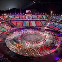 General view of images of flags are being projected on the stands as athletes enter the stadium during the closing ceremony of the 2018 Pyeongchang Olympics on Sunday night at Pyeongchang Stadium. Message of peace delivered as Pyeongchang Olympics wrap up