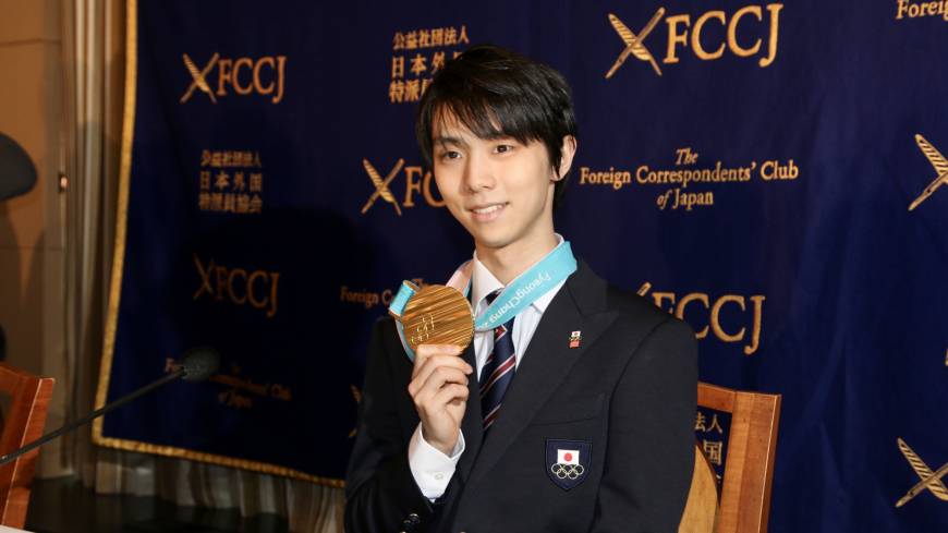 Figure skater Yuzuru Hanyu displays his Pyeongchang Olympic gold medal at a news conference on Tuesday. Yuzuru Hanyu reflects on Olympic glory