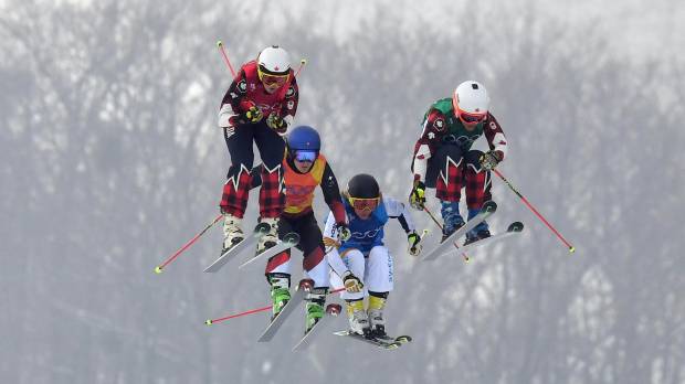 Olympic ski cross finalists (from left) Kelsey Serwa of Canada, Fanny Smith of Switzerland, Sandra Naeslund of Sweden and Canada’s Brittany Phelan compete on Friday. Kelsey Serwa and Brittany Phelan give Canada 1-2 ski cross finish