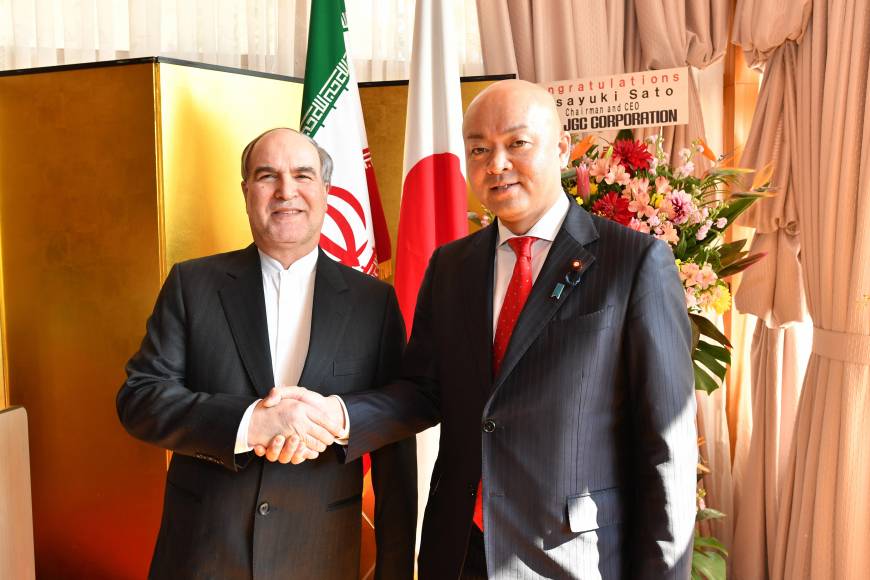 Mashaallah Shakeri (left), acting head of the Iran Embassy, greets Manabu Horii, parliamentary vice-minister for Foreign Affairs, during a reception to mark the anniversary of the 1979 Islamic Revolution in Iran at the ambassador